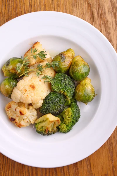 Baked cauliflowers, broccoli and Brussels sprouts