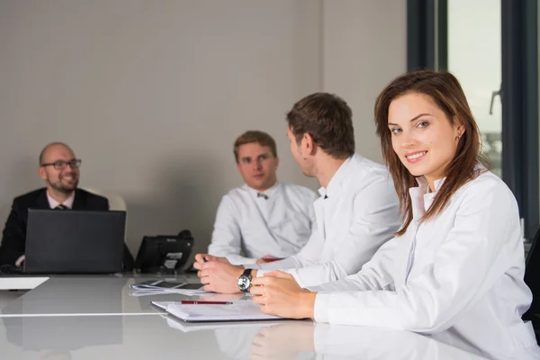 Medical consultation with three doctors and businesman