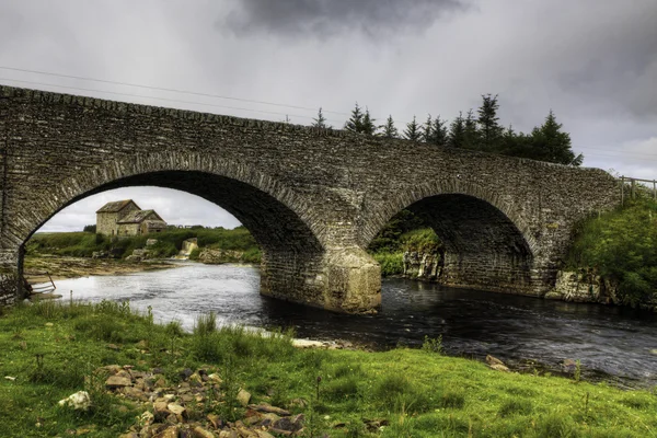An old stone mill and bridge in Thurso, Scotland