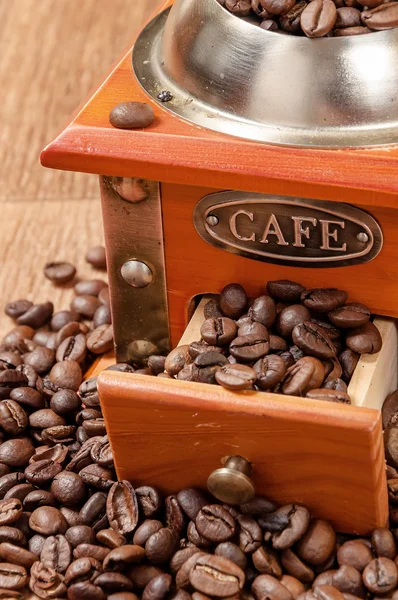 Vintage manual coffee grinder with beans