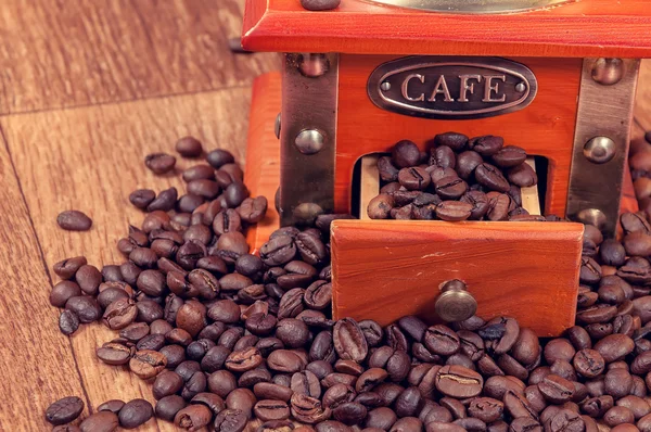 Vintage manual coffee grinder with beans