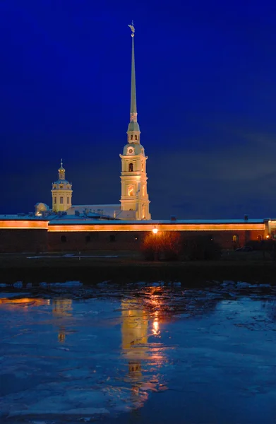 Saint Petersburg. Peter and Paul Fortress is reflected in the ice one winter evening.