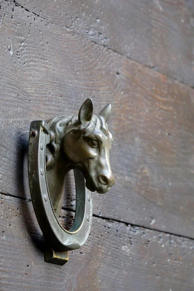 Bronze door knocker in form of the horse head