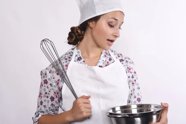 Female chef with kitchen tools