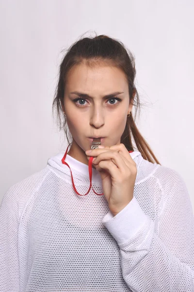 Athlete young woman with whistle.