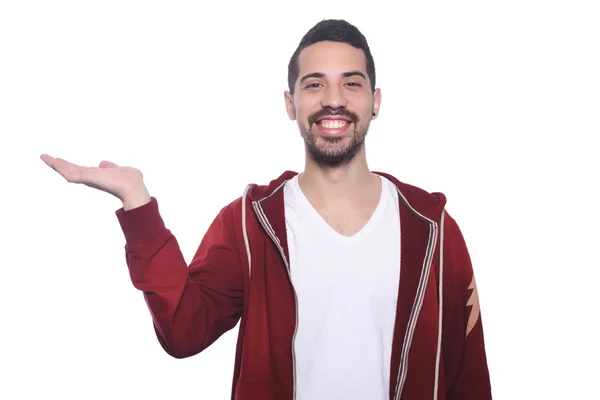 Young latin man holding something on the palm.