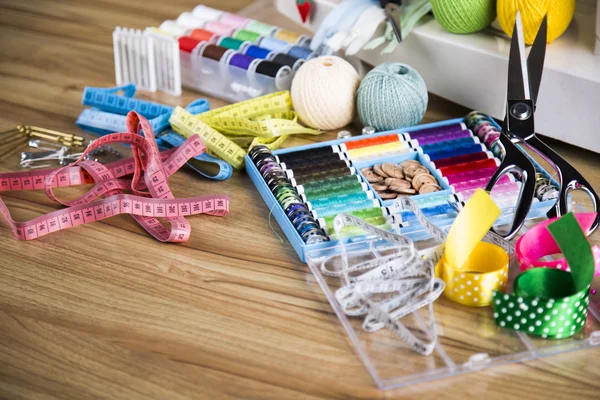 Sewing accessories on wooden table