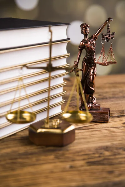 Golden scales of justice, books, Statue of Lady Justice. Owl and paragraph