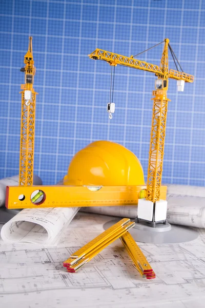 Buildings under construction and cranes. Building projects