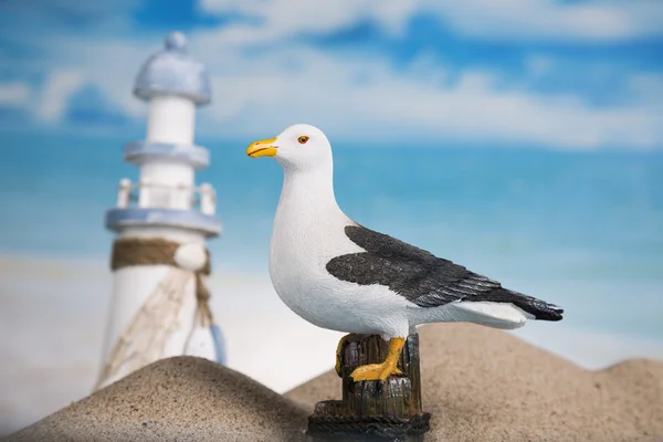 Holiday by the sea, lighthouse, seagull, sand