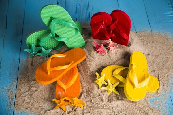 Vacation, sand, colorful molds for the sandbox, flip-flops colorful shells, the belt for swimming