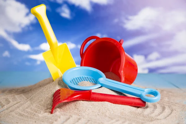 Vacation, sand, colorful molds for the sandbox, flip-flops colorful shells, the belt for swimming