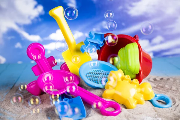 Vacation, sand, colorful molds for the sandbox, flip-flops colorful shells, the belt for swimming