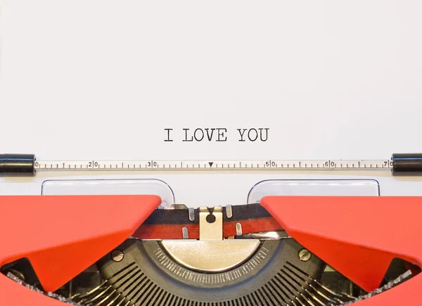 Close up image of typewriter with paper sheet and the phrase: I love you. copy space for your text. retro filtered