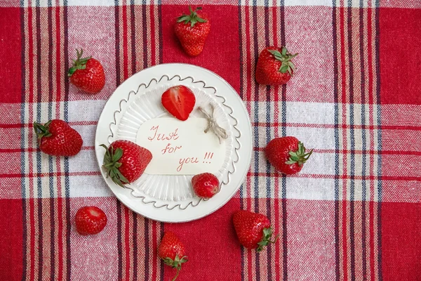 Red Fresh Strawberries on the Ceramic White Plate on the Check Tablecloth.Breakfast Organic Healthy Tasty Food.Wish Card.Cooking Vitamins Ingredients.Summer Fruits.Top View