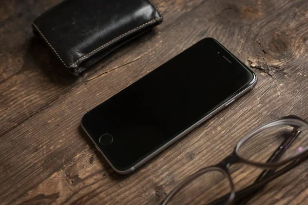 Smartphone, purse and glasses