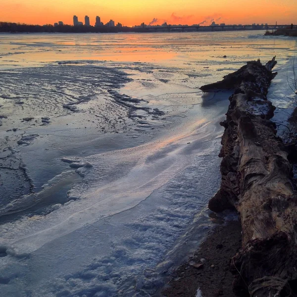 Frozen river at sunset