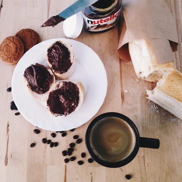Coffee, cookies and bread with chocolate pasta