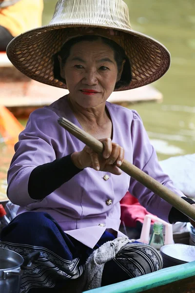 Portrait of woman in boat at floating market