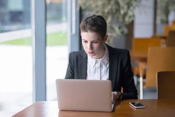 Young pretty business woman with notebook