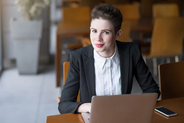 Young pretty business woman with notebook