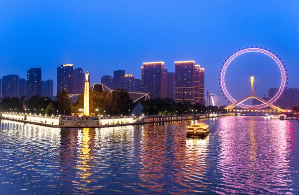 Tianjin is a metropolis in northern coastal China, tall giant Ferris wheel built above the Yongle Bridge, over the Hai River in Tianjin.