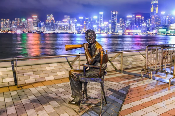 HONG KONG, CHINA - JUNE 09: Statue and skyline in Avenue of Star