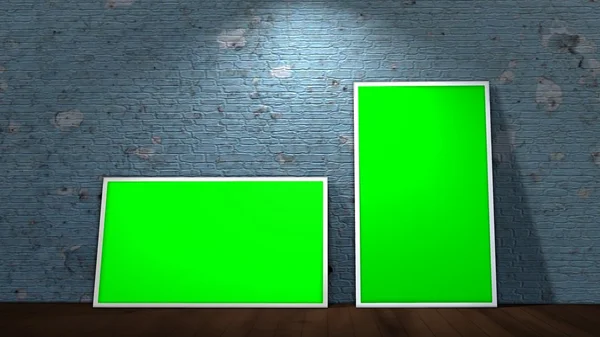 Two green screen frames on old brick wall and wooden floor illuminated with spotlights