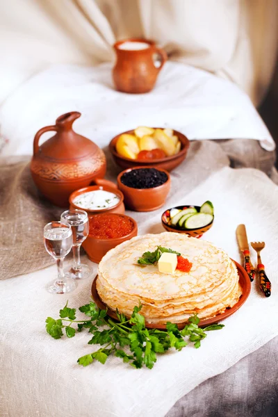 Stack pancakes with red caviar and parsley butter rural rustic still life pottery canvas village