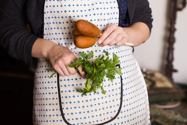 Corndog with mustard, ketchup and parsley hands, recipe, cooking, hostess apron
