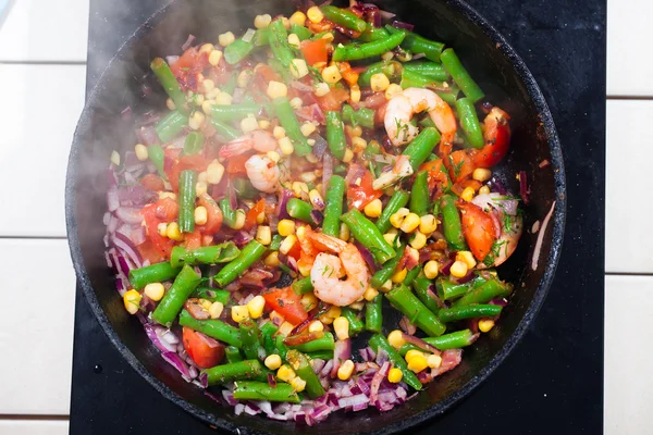 Vegetables in a pan, steam, top, green beans, onions, tomatoes, shrimp