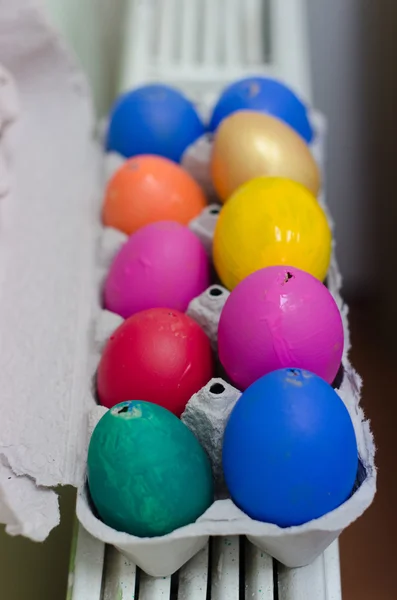 Many painted colorful easter eggs in tray