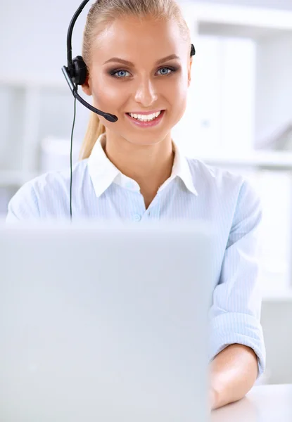 Close-up portrait of a customer service agent sitting at office