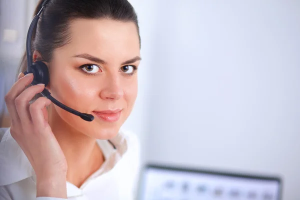 Close-up portrait of a customer service agent sitting at office