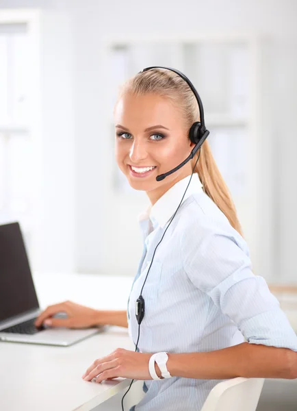 Close-up portrait of a customer service agent sitting at office