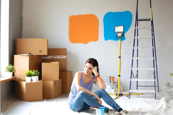Young woman portrait while painting new apartment