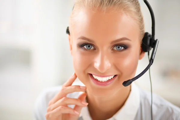 Close-up portrait of a customer service agent sitting at office