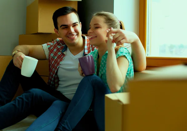 Portrait of young couple moving in new home