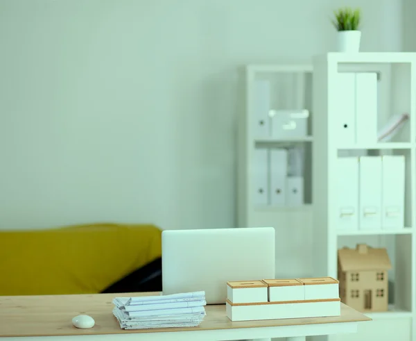 Modern office interior with tables, chairs and bookcases