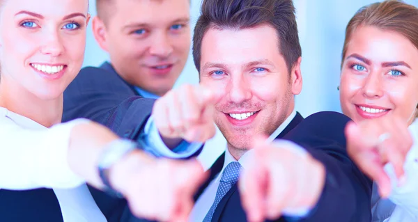 Group of business people pointing to you