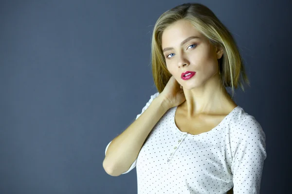 Portrait of a cute woman in sweater at home