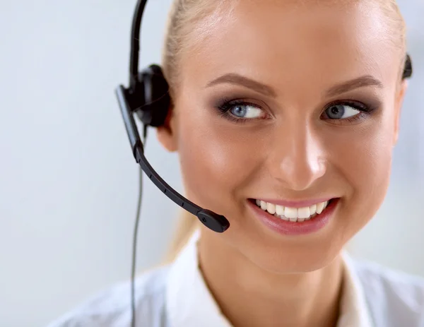 Close-up portrait of a customer service agent sitting at office