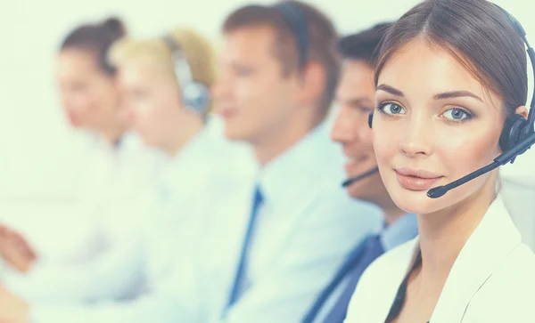 Attractive Smiling positive young businesspeople and colleagues in a call center office