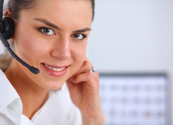 Close-up portrait of a customer service agent sitting at office