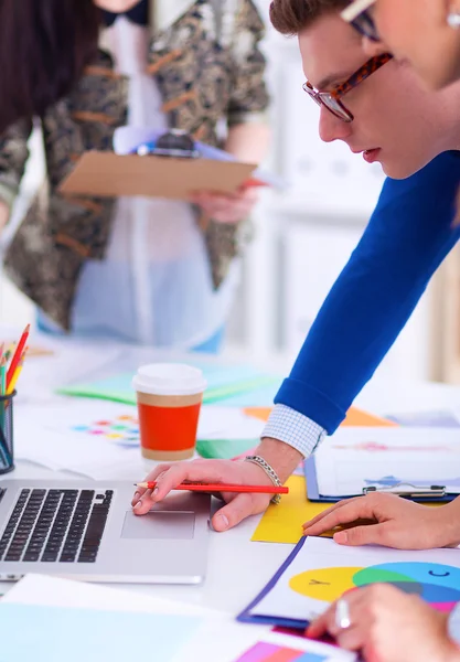 Young business people working at office on new project