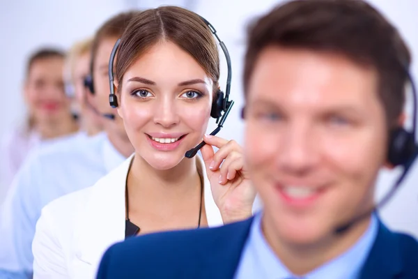 Attractive Smiling positive young businesspeople and colleagues in a call center office