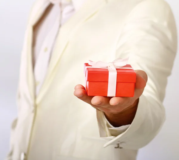 Business man offering a gift