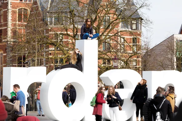 People posing for photo on the letters of writing, I amsterdam, Museumplein, Rijksmuseum, Holland
