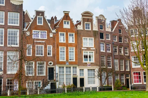 Begijnhof courtyard with historic houses in Amsterdam, Netherlands