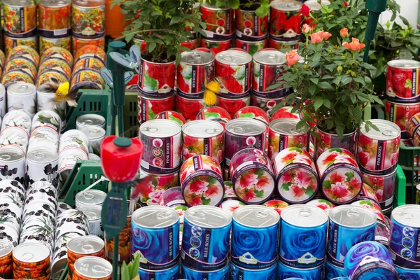 Cans with roses, souvenirs for sale at Dutch flower market, Amsterdam, Netherlands